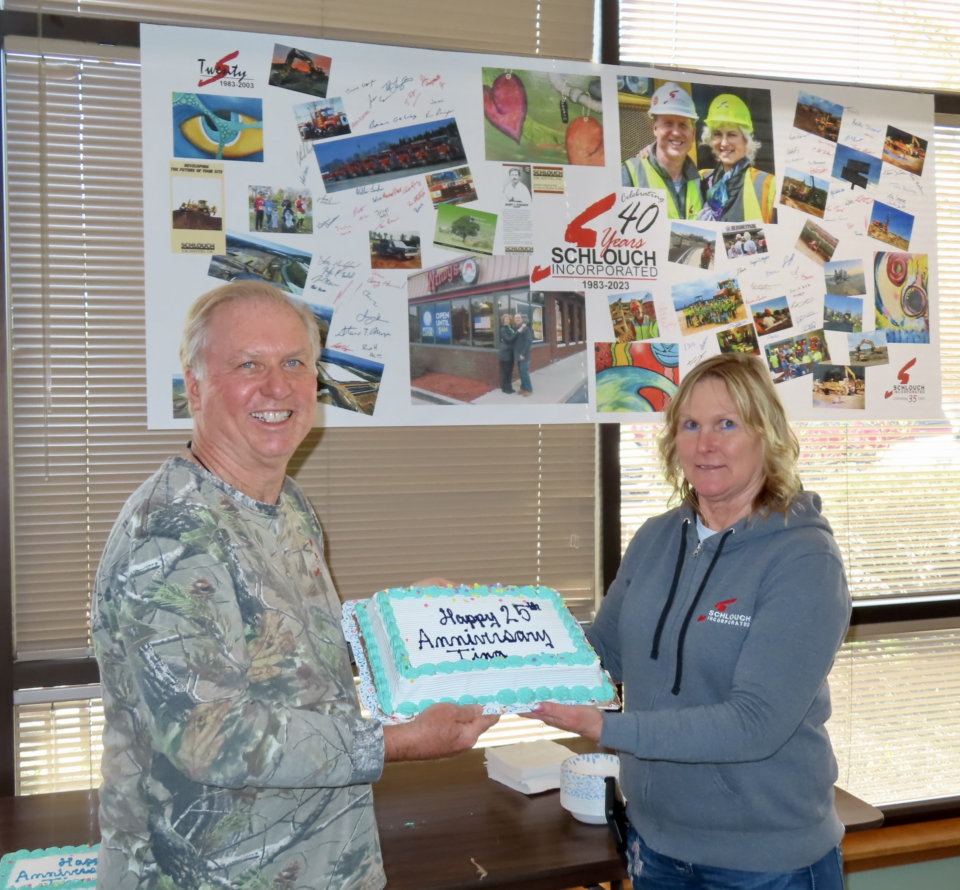 Barry and wife Deb celebrate a work anniversary with one of many cakes given out each year.