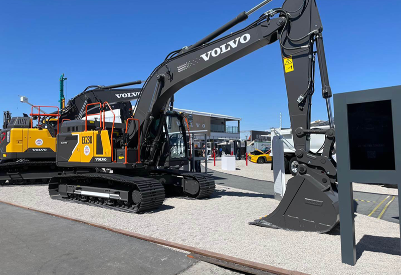 Matt Stanley and group posing for photo in front of Wirtgen equipment