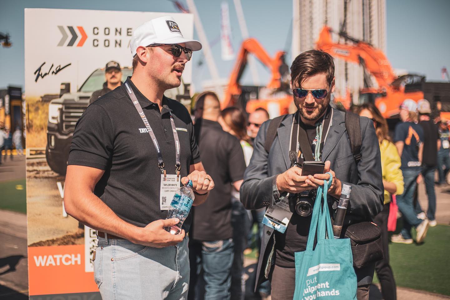 Taylor White talking with people at the show