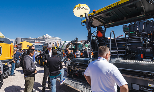 People at CONEXPO-CON/AGG gathered around a machine
