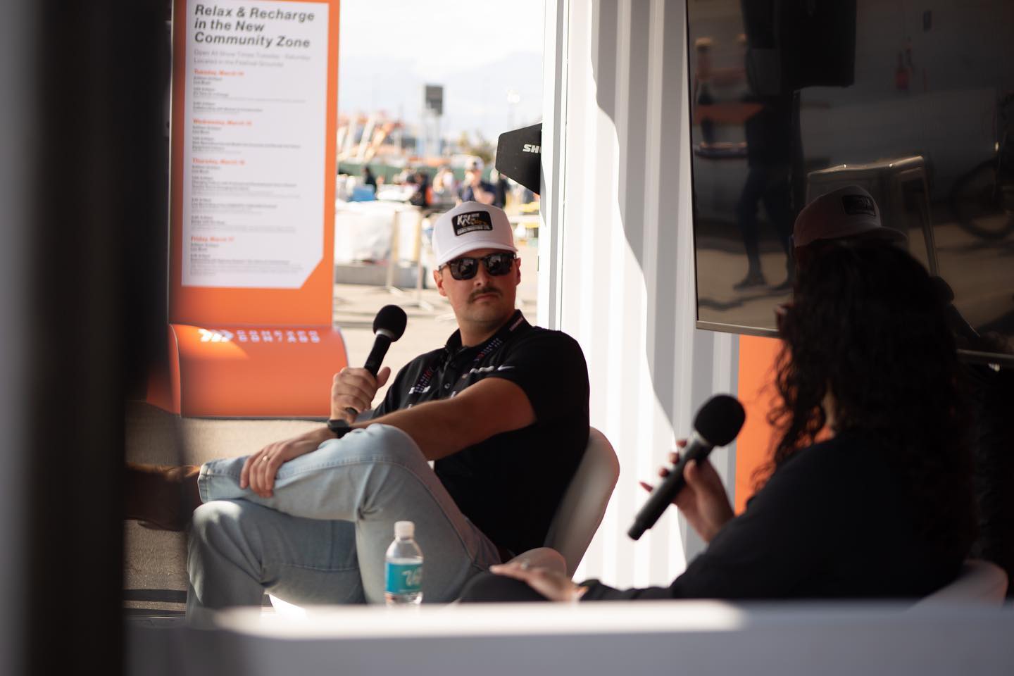 Taylor white and Dana creating a live podcast at CONEXPO-CON/AGG 2023