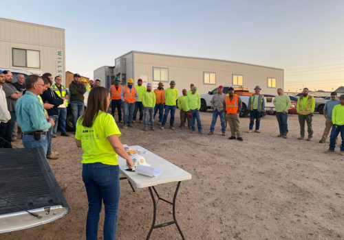 Construction huddle meeting on jobsite