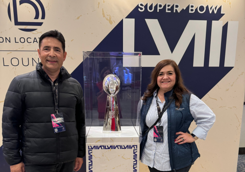 Sweepstakes winners next to Lombardi Trophy