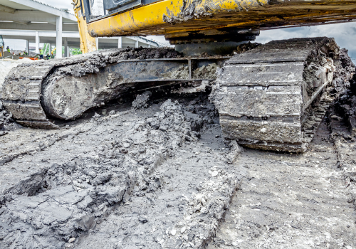 cleaning excavator tracks