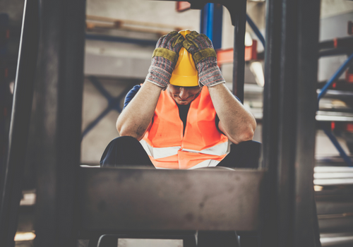 Forklift driver feeling frustrated while working in aluminum mill.